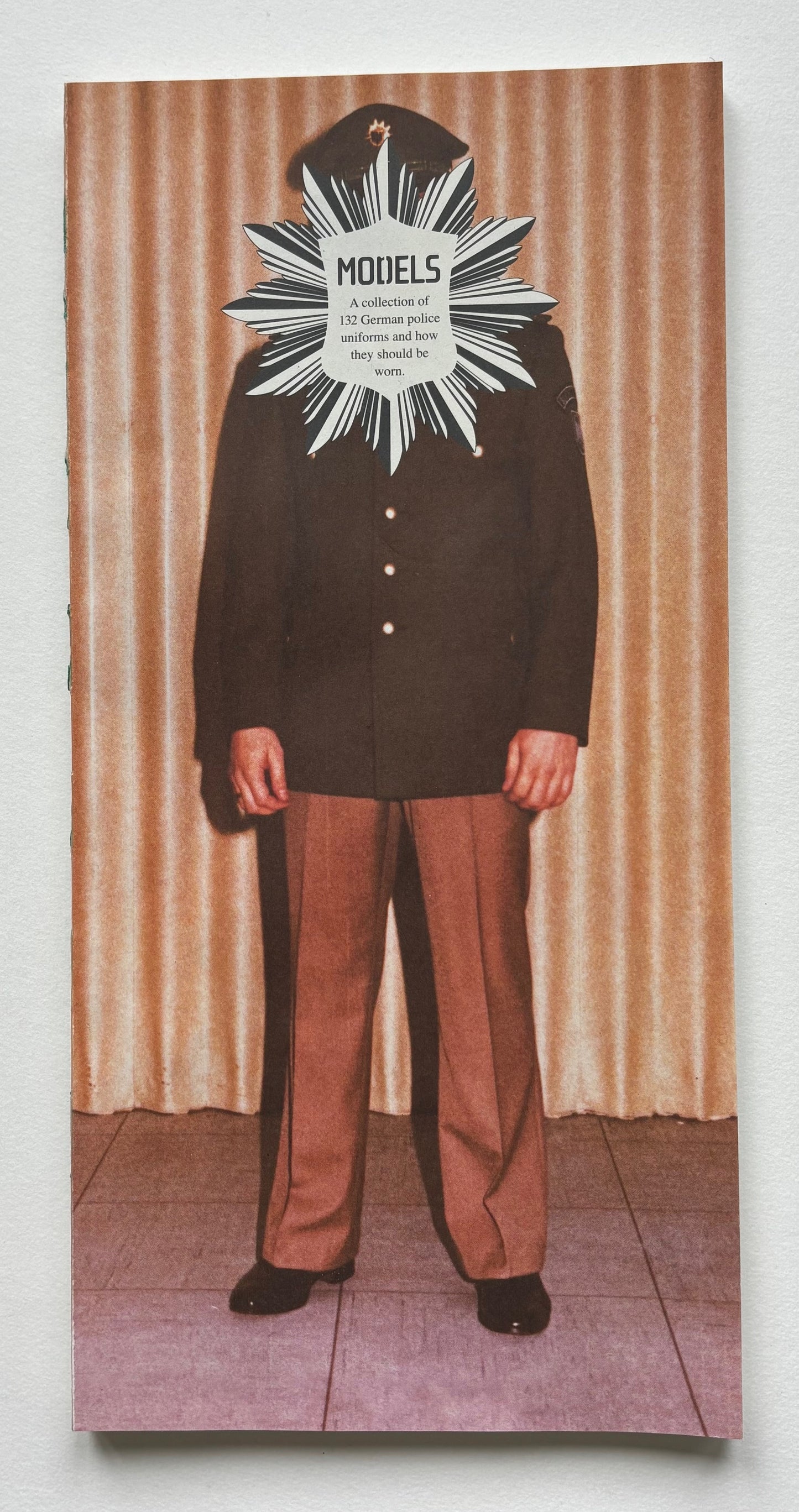 MODELS. A collection of 132 German police uniforms and how they should be worn.